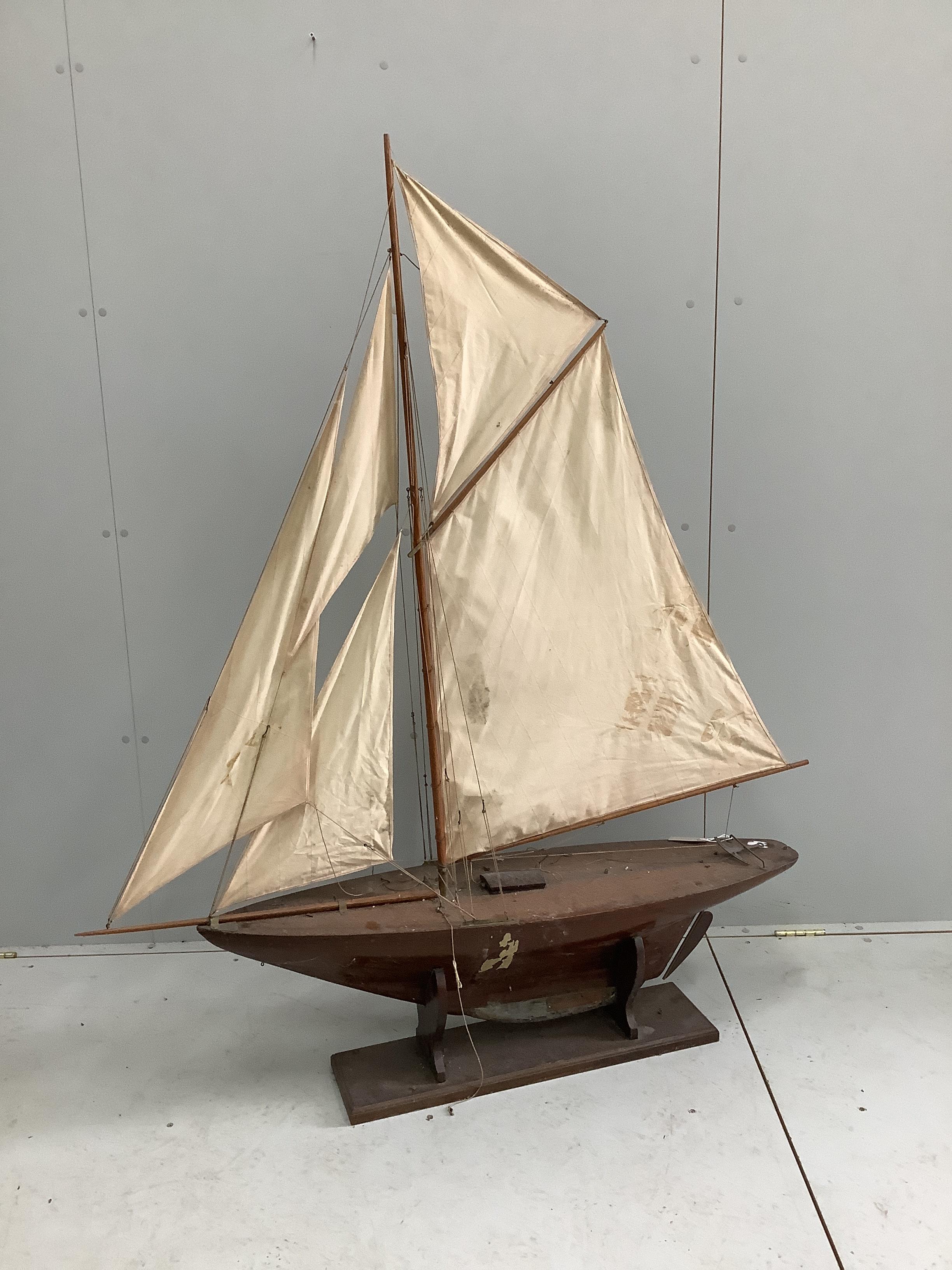 A vintage pond yacht with weighted hull, length 130cm, height including stand 152cm